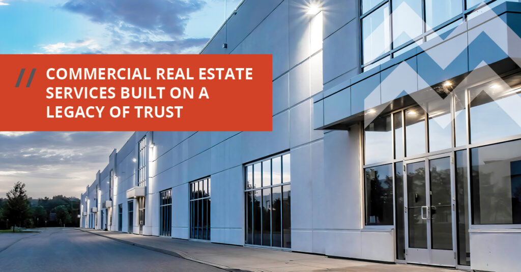 Commercial real estate building with text stating Built on a Legacy of Trust